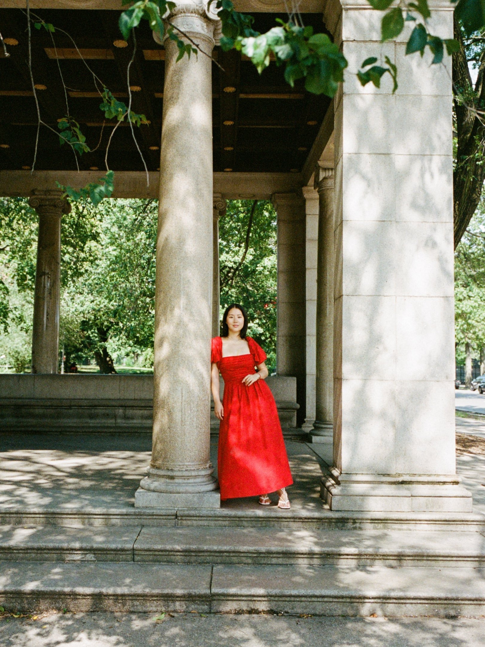 Sophia is wearing the Rachelle Dress in CHERRY.